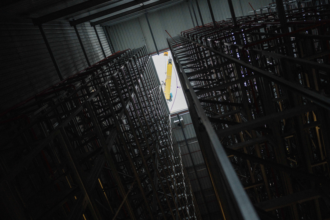 Storage and retrieval machines are brought into the high-bay warehouse 