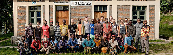 Project team in front of a house in Bugarula