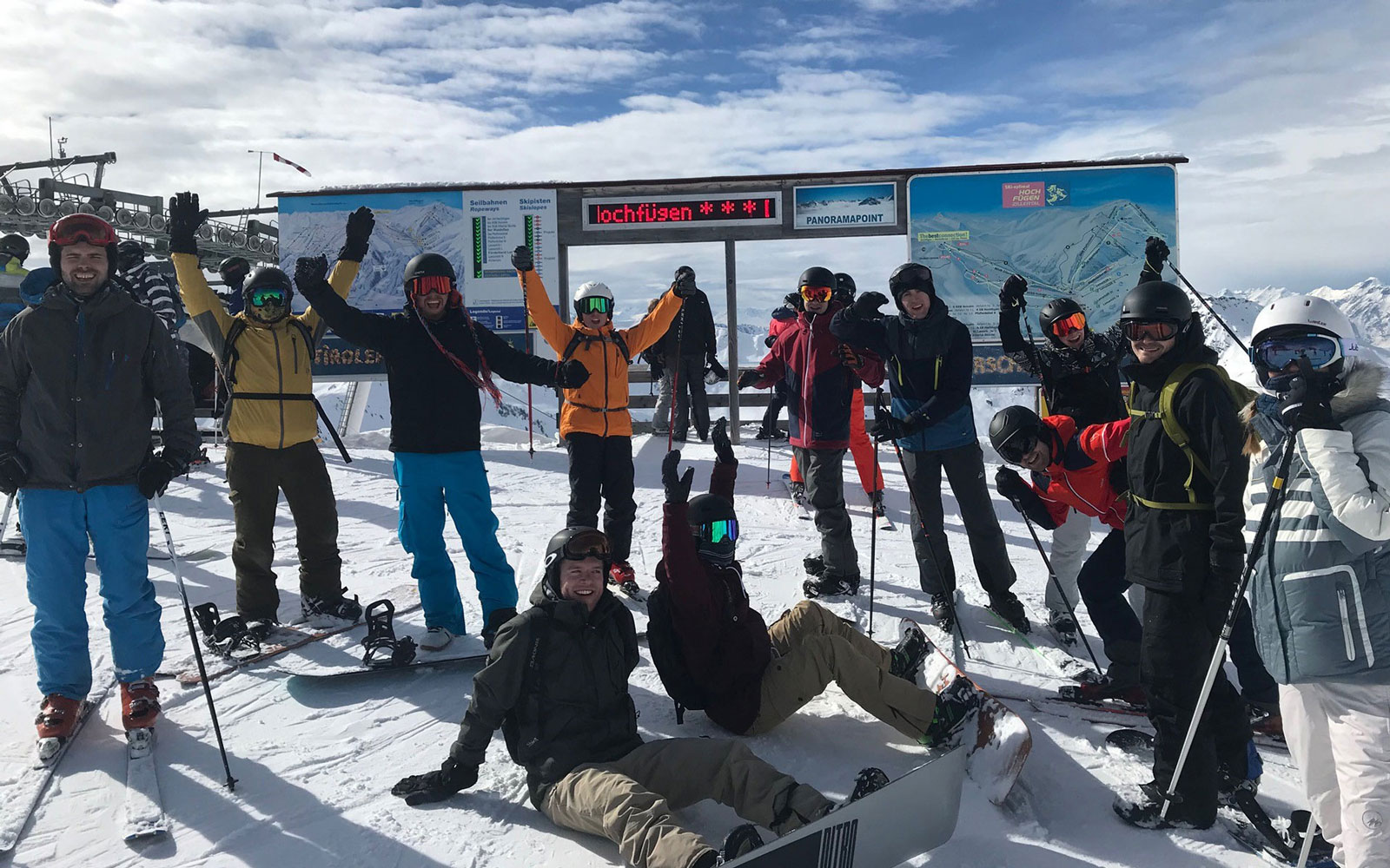 Employees on a ski slope at a team event.