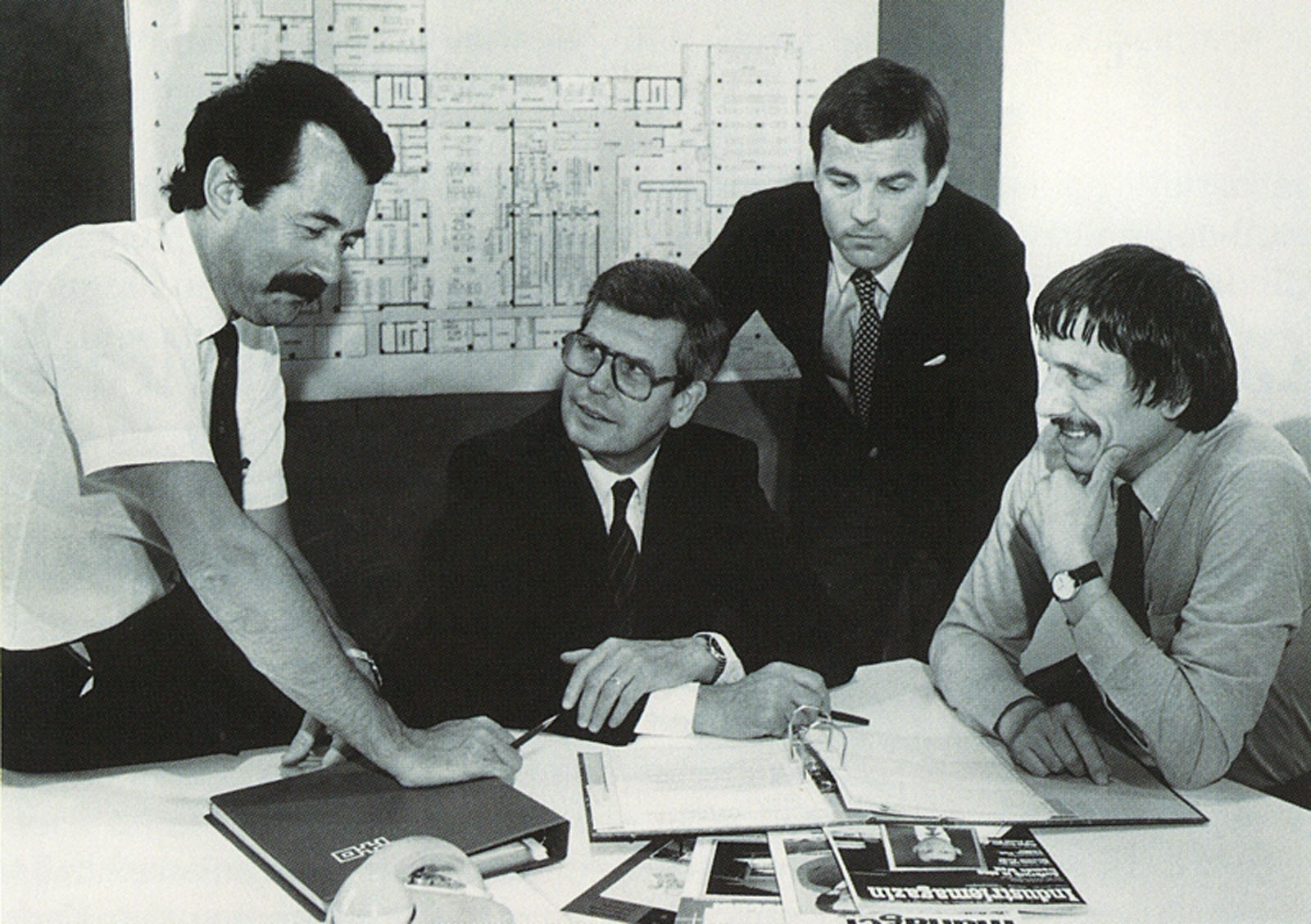 Black and white picture of an architect's meeting