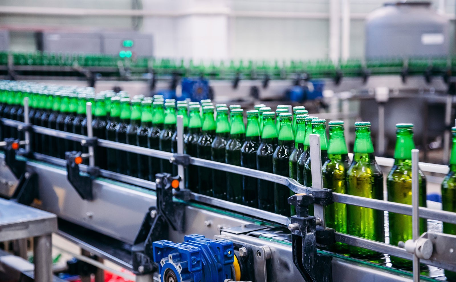 Filling line of beverage bottles in the factory