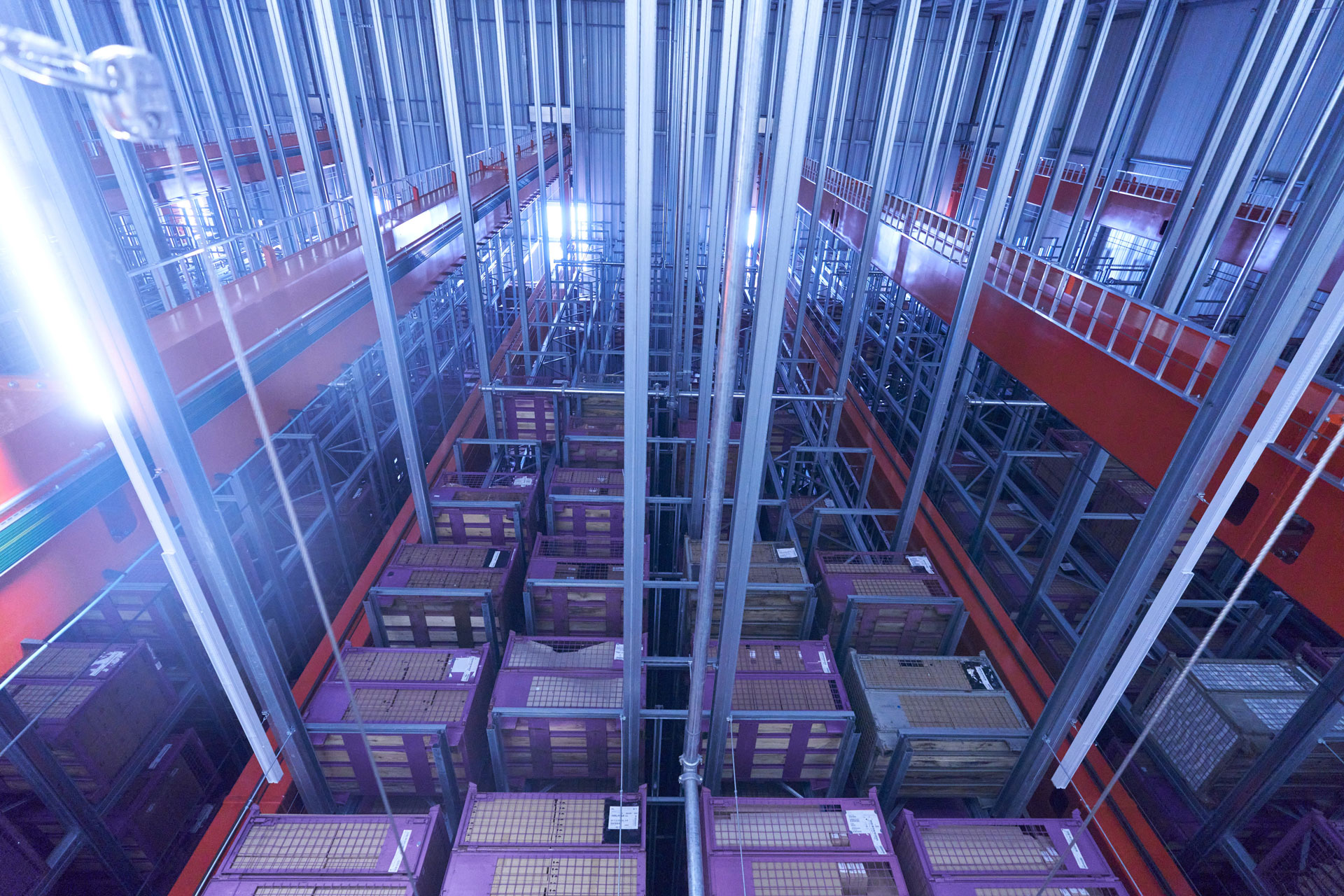 View from above into a high-bay warehouse with lattice boxes