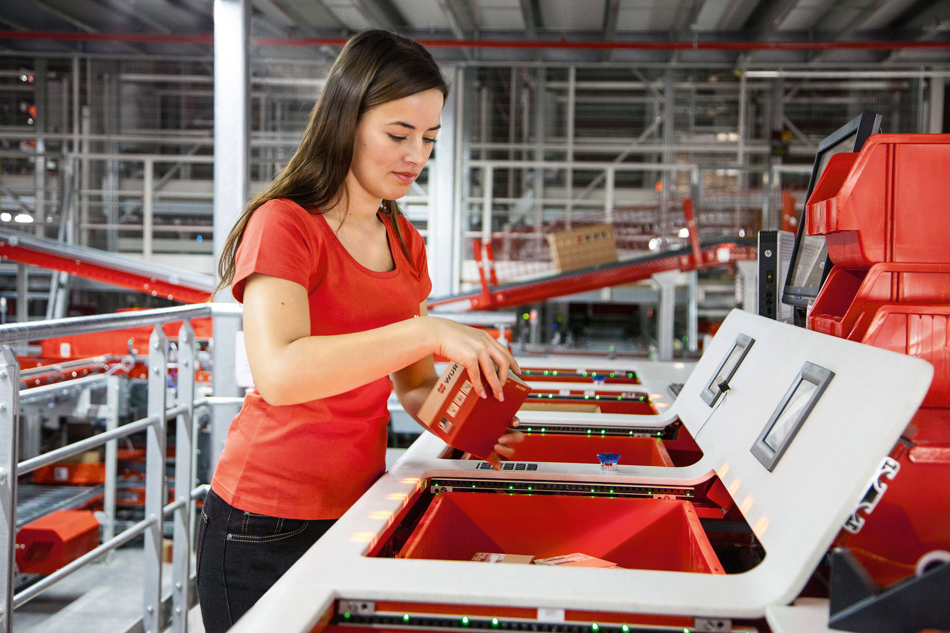 Employee in the warehouse sorting for the individualized delivery service